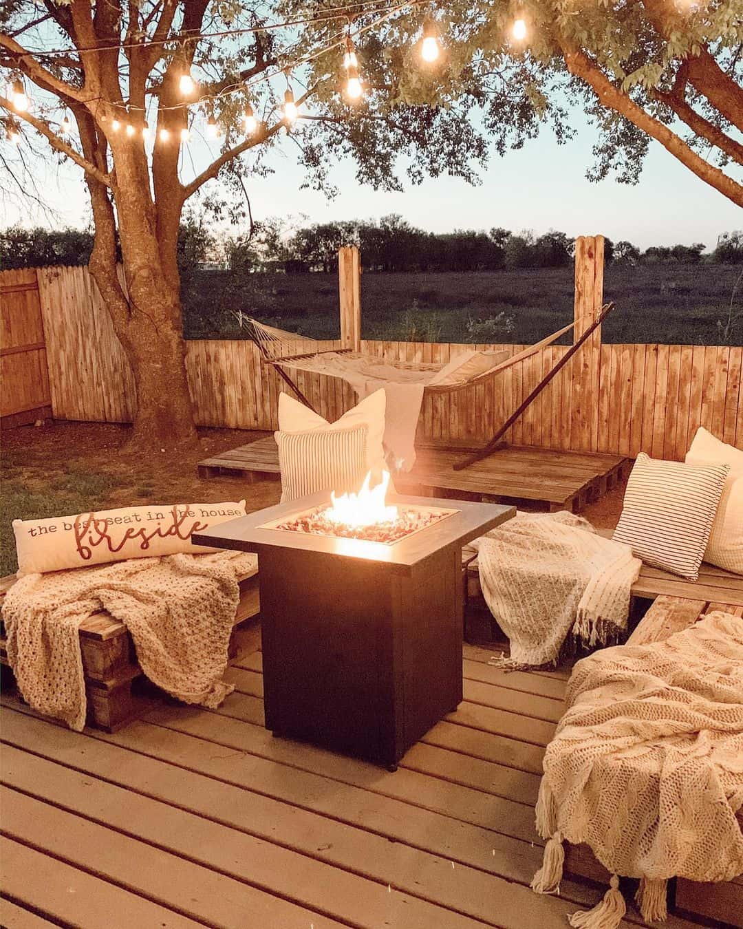 Built-in Wooden Benches Frame a Square Fire Pit