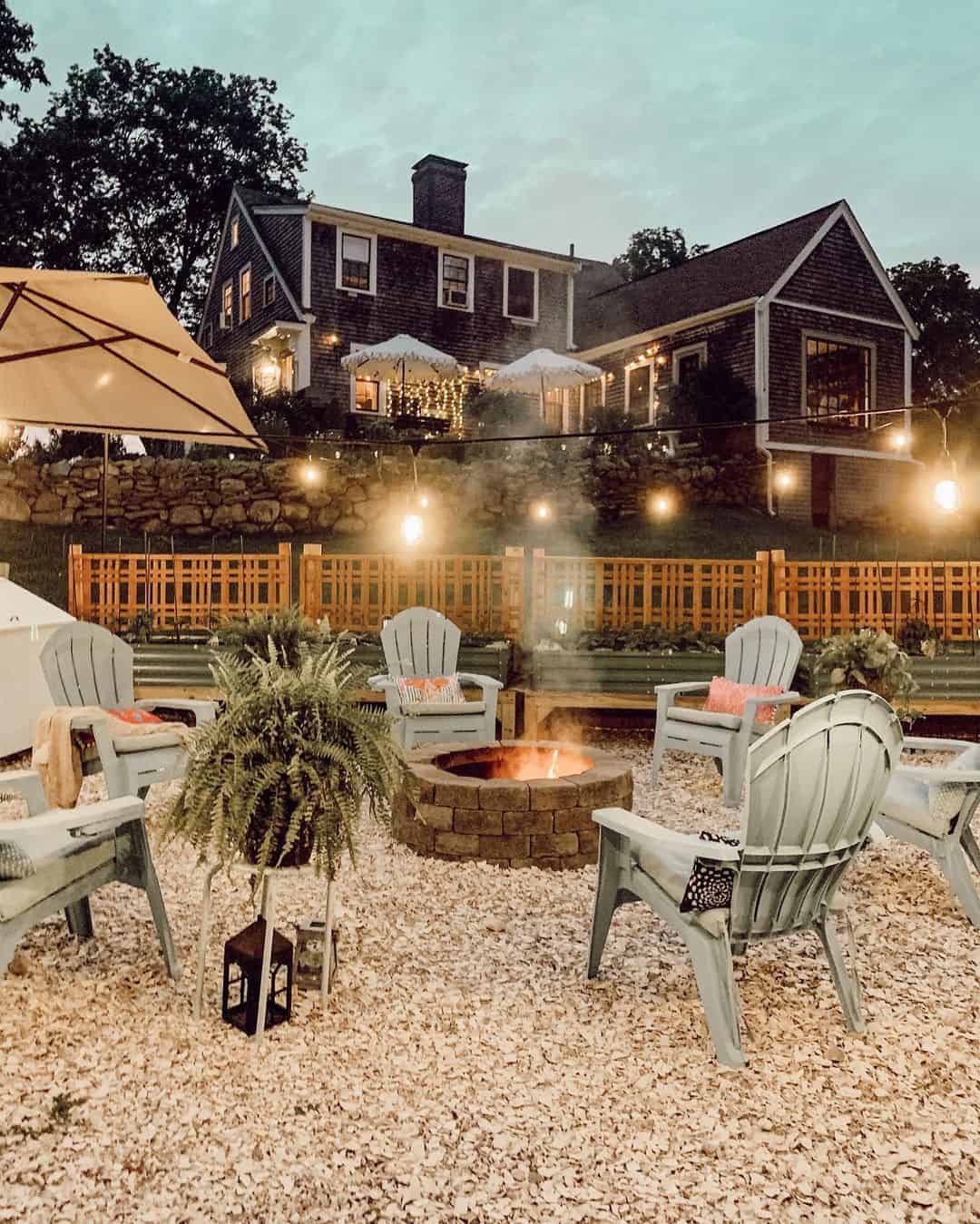 Circular Stone Fire Pit Anchors a Gravel Patio