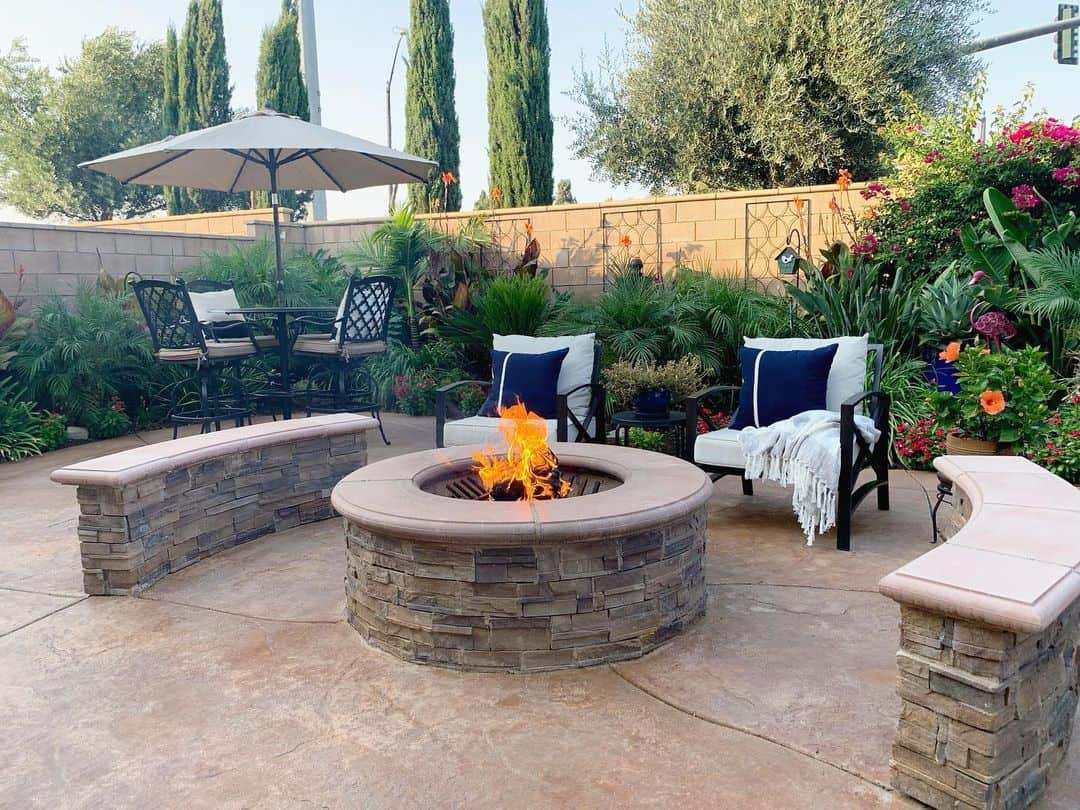 Stone Bench Seating Frames a Circular Fire Pit