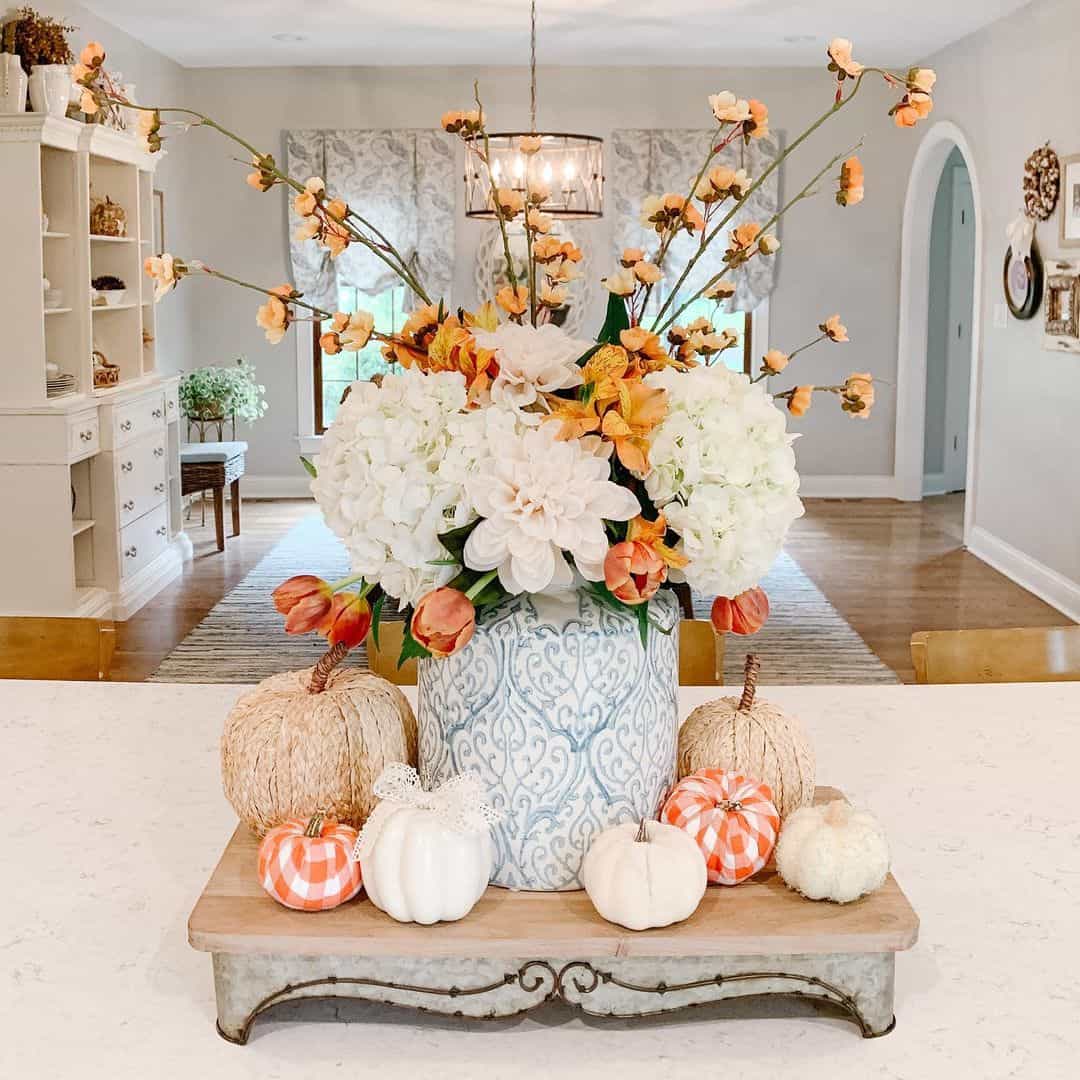 Blue and White Vase Anchors a Festive Pumpkin Display