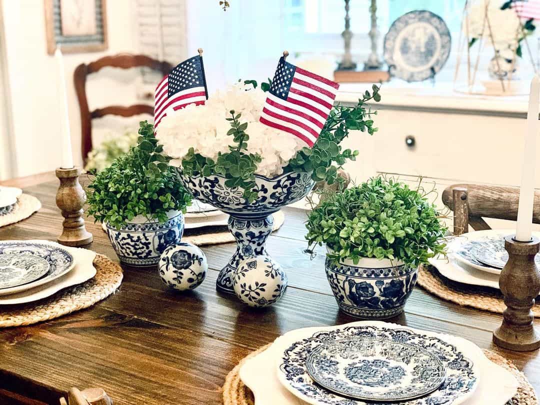 Blue and White Planters Flank a Festive Floral Centerpiece