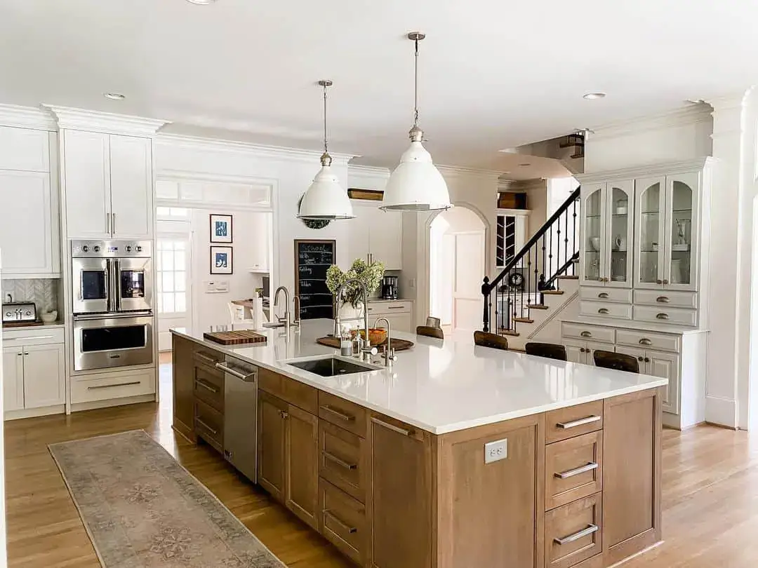 Natural Wood Island Cabinets Feature Integrated Drawer Pulls