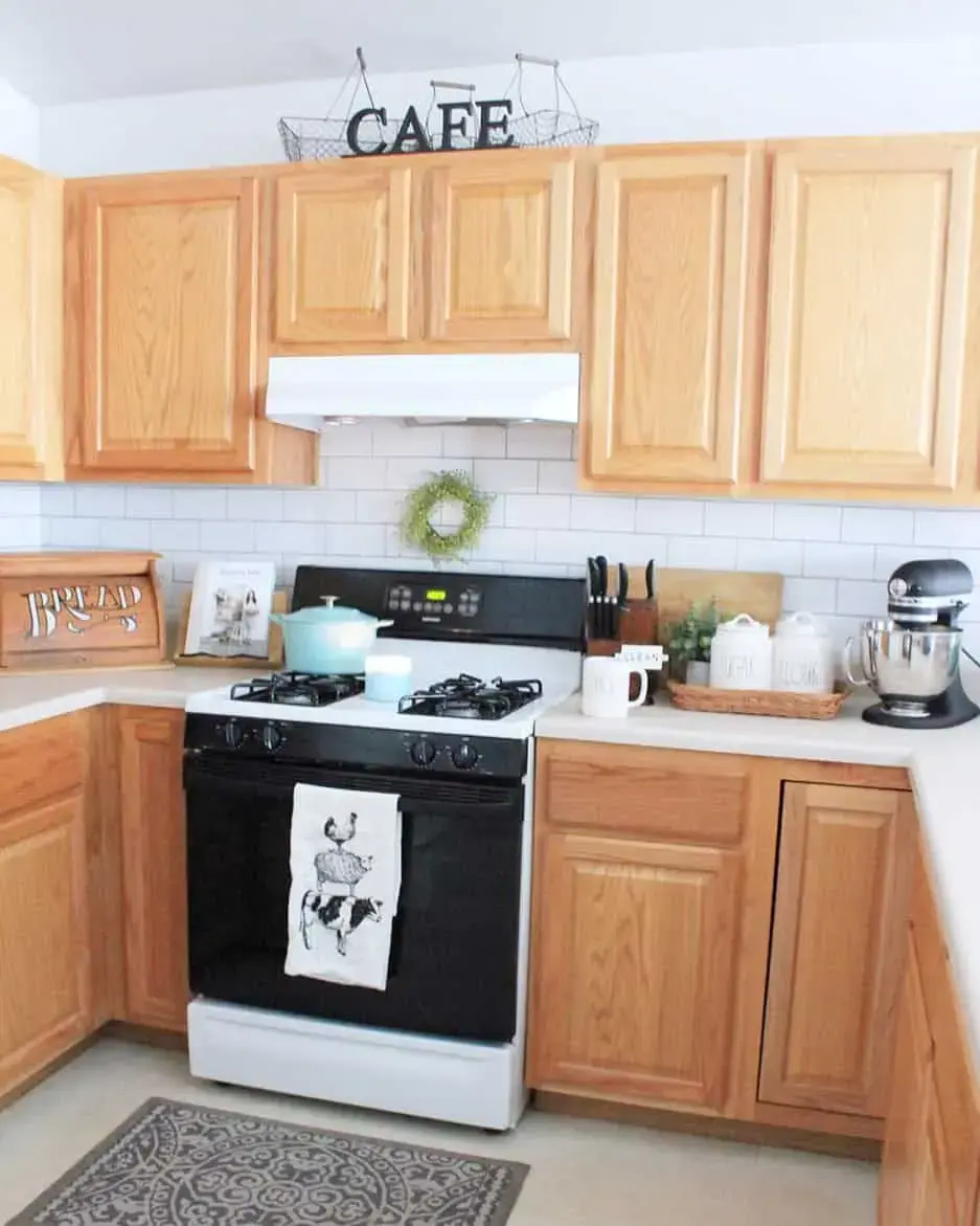 Natural Wood Cabinets Offer Open Shelving Above the Counter