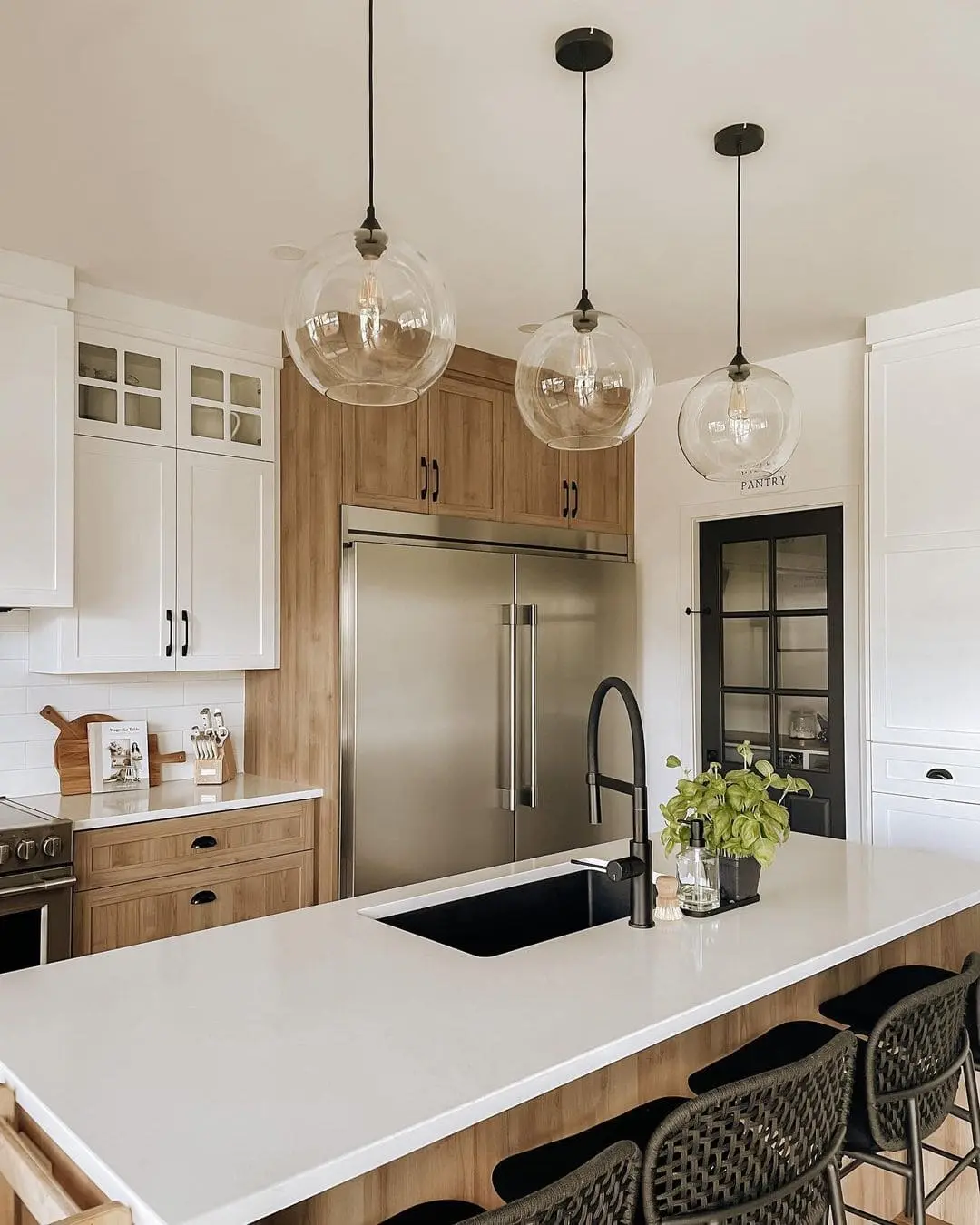 Natural Wood Cabinets Blend With Stainless Steel Appliances