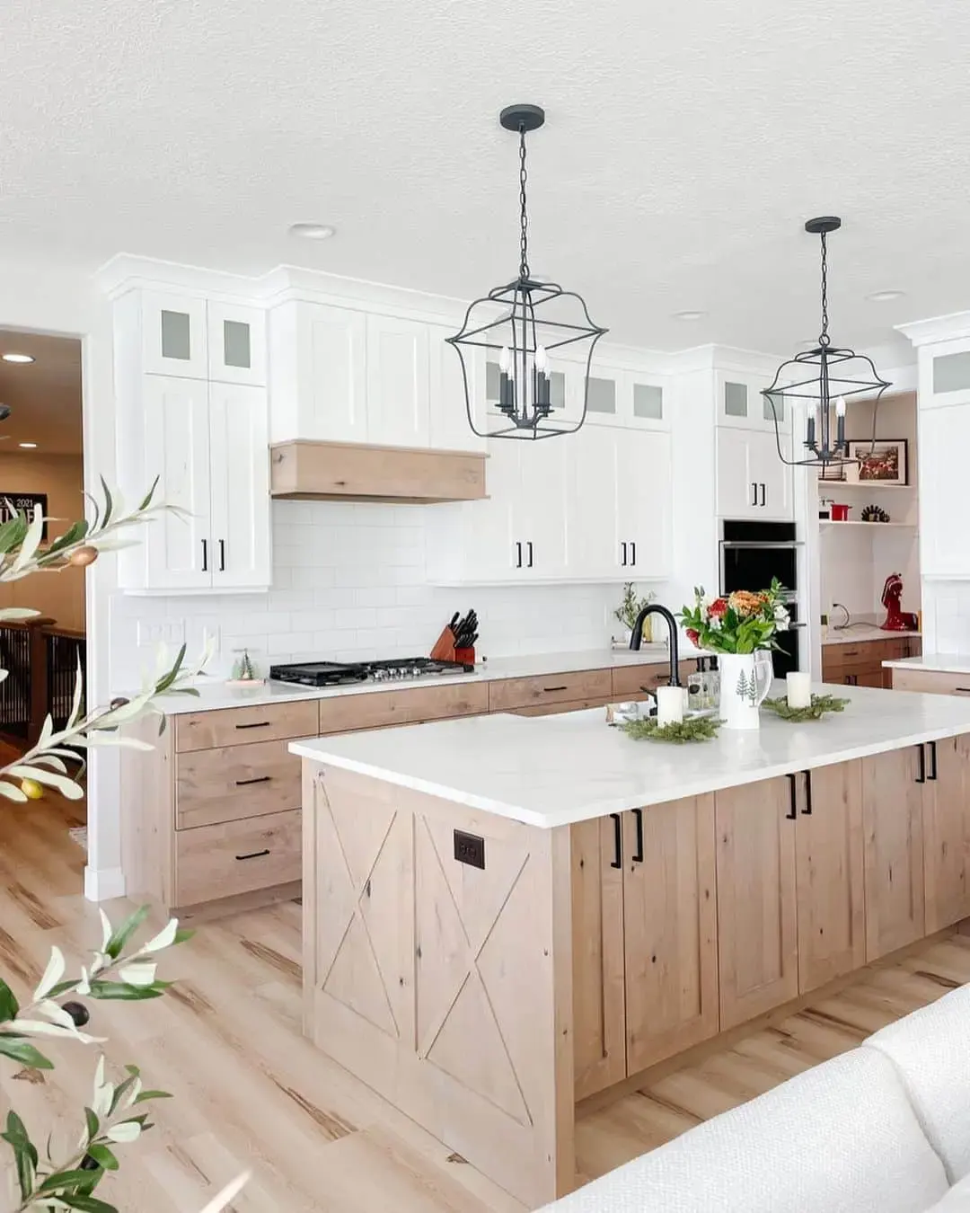 Light Wood Island Features X-Panel Doors for Farmhouse Charm