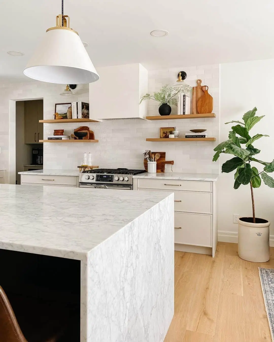Oak Shelves Display a Black Vase and Greenery