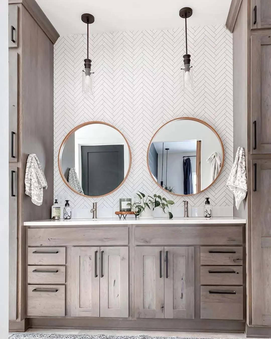 Herringbone Tile Backsplash Adds Pattern to Wood Vanity