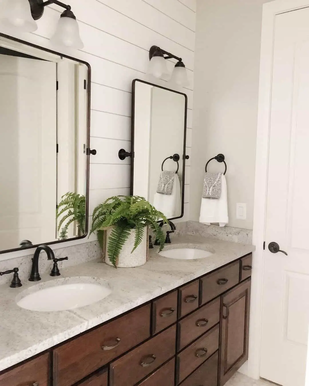 Tall Rectangular Mirrors Frame Each Sink