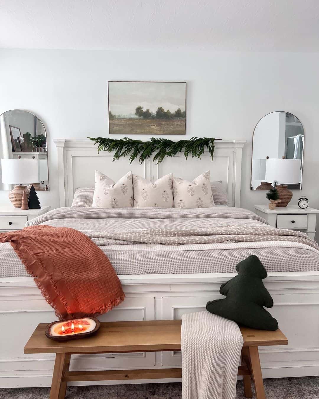 Greenery Garland Frames Artwork Above the Bed