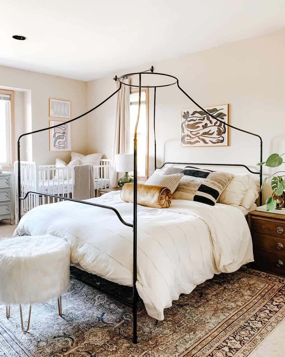 Black Metal Canopy Bed Frame Defines a Cozy Sleeping Area