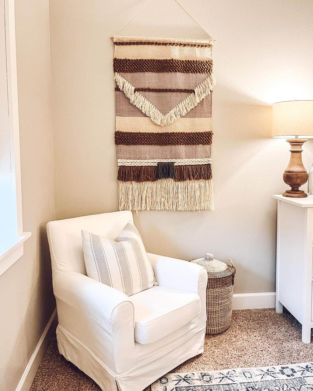 Incorporate fringe and geometric patterns on a wall hanging