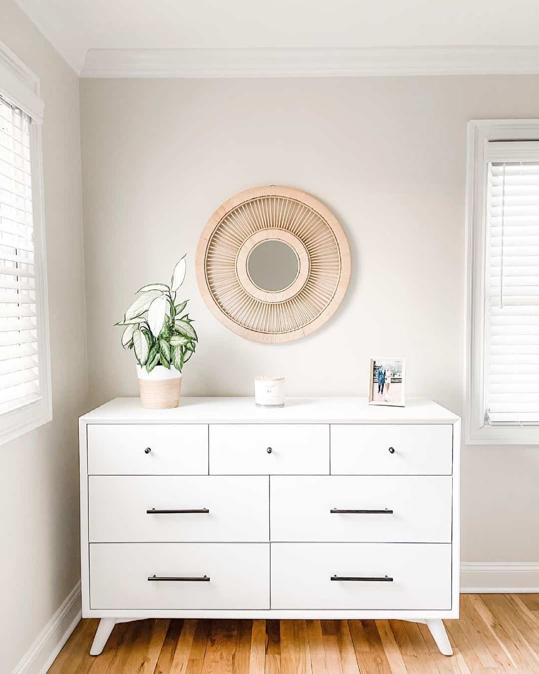 Round Rattan Mirror Adds Textured Focal Point Above Dresser