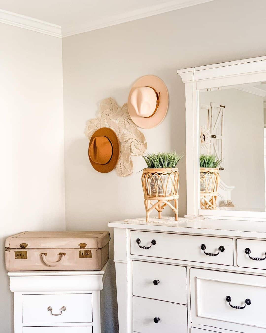 Layered doily creates a soft backdrop for hanging hats