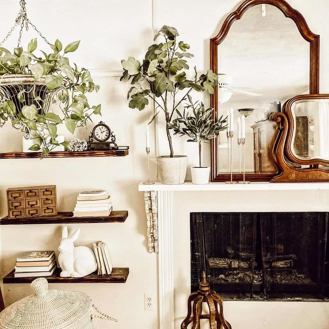 Layered Mirrors and Tall Plants Frame a Fireplace