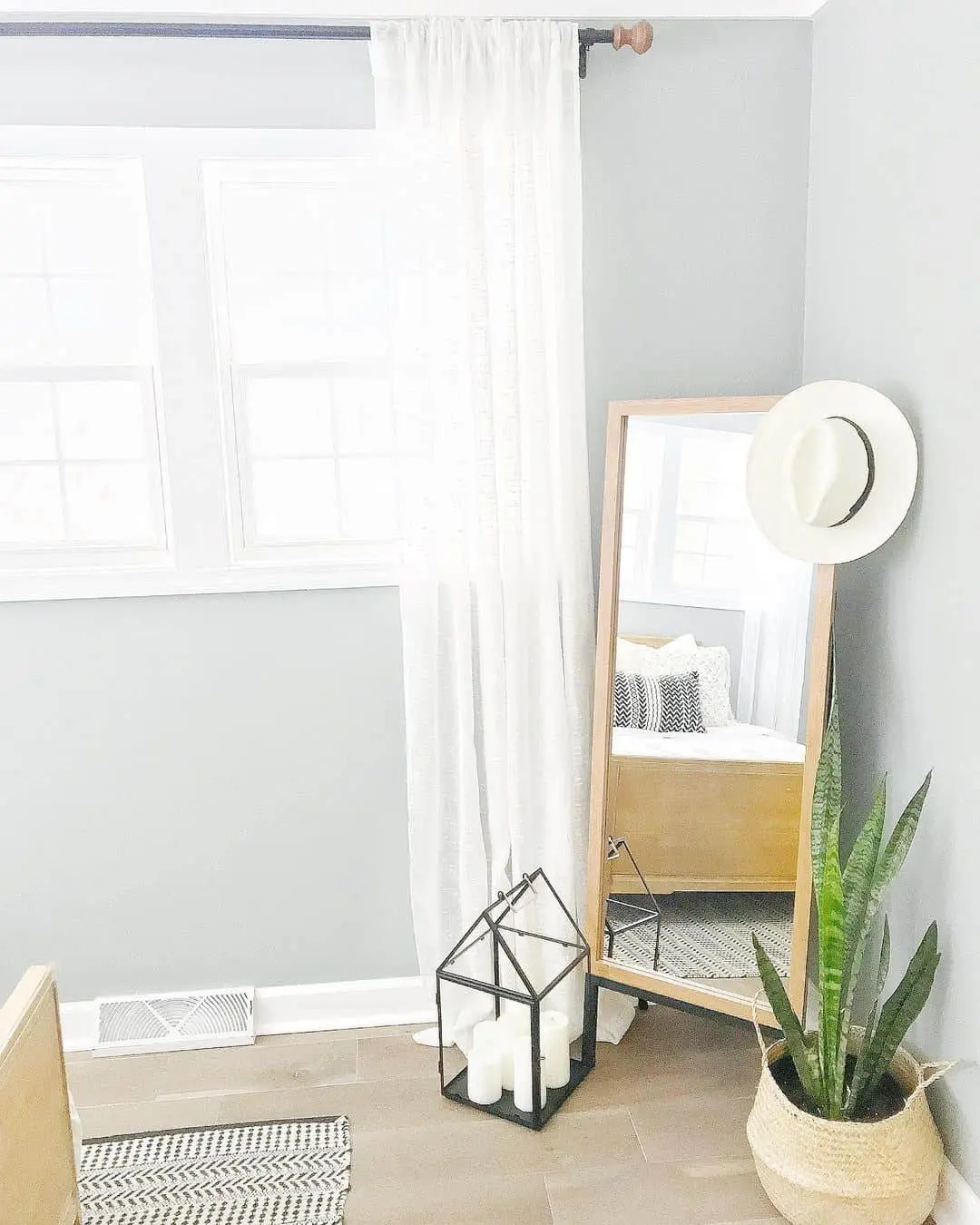 Floor Mirror Reflects Cozy Bedroom Details