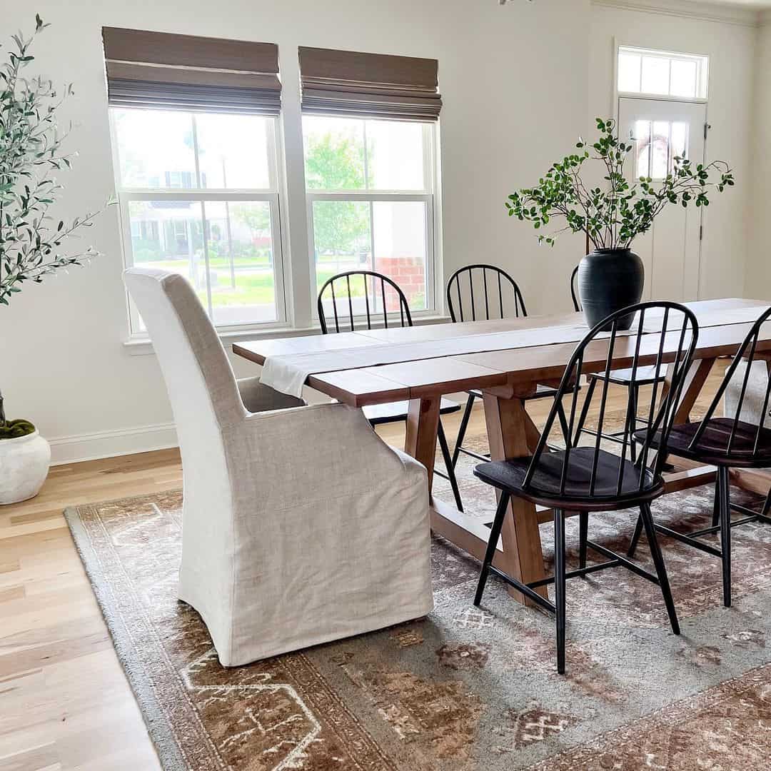 Slipcovered Armchair to Soften a Rustic Table