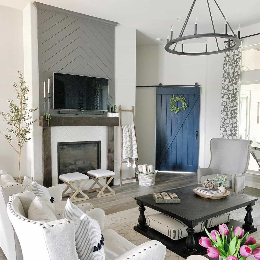 Chevron Wood Paneling Above Fireplace Creates a Textured Focal Point