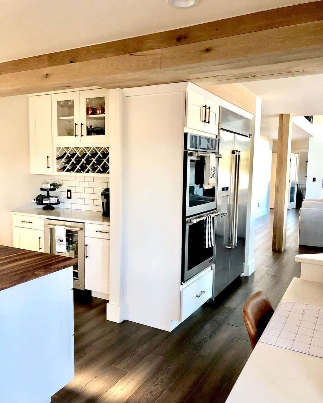 Built-in Wine Cubbies Below Glass-Front Cabinets