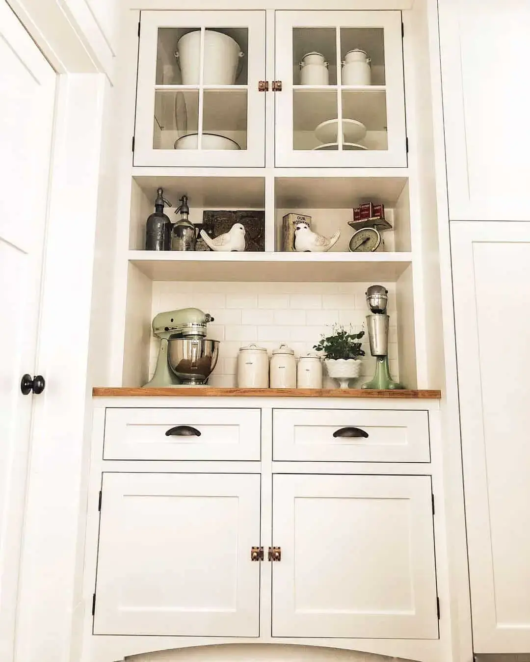 Showcase White Kitchenware Behind Glass Doors