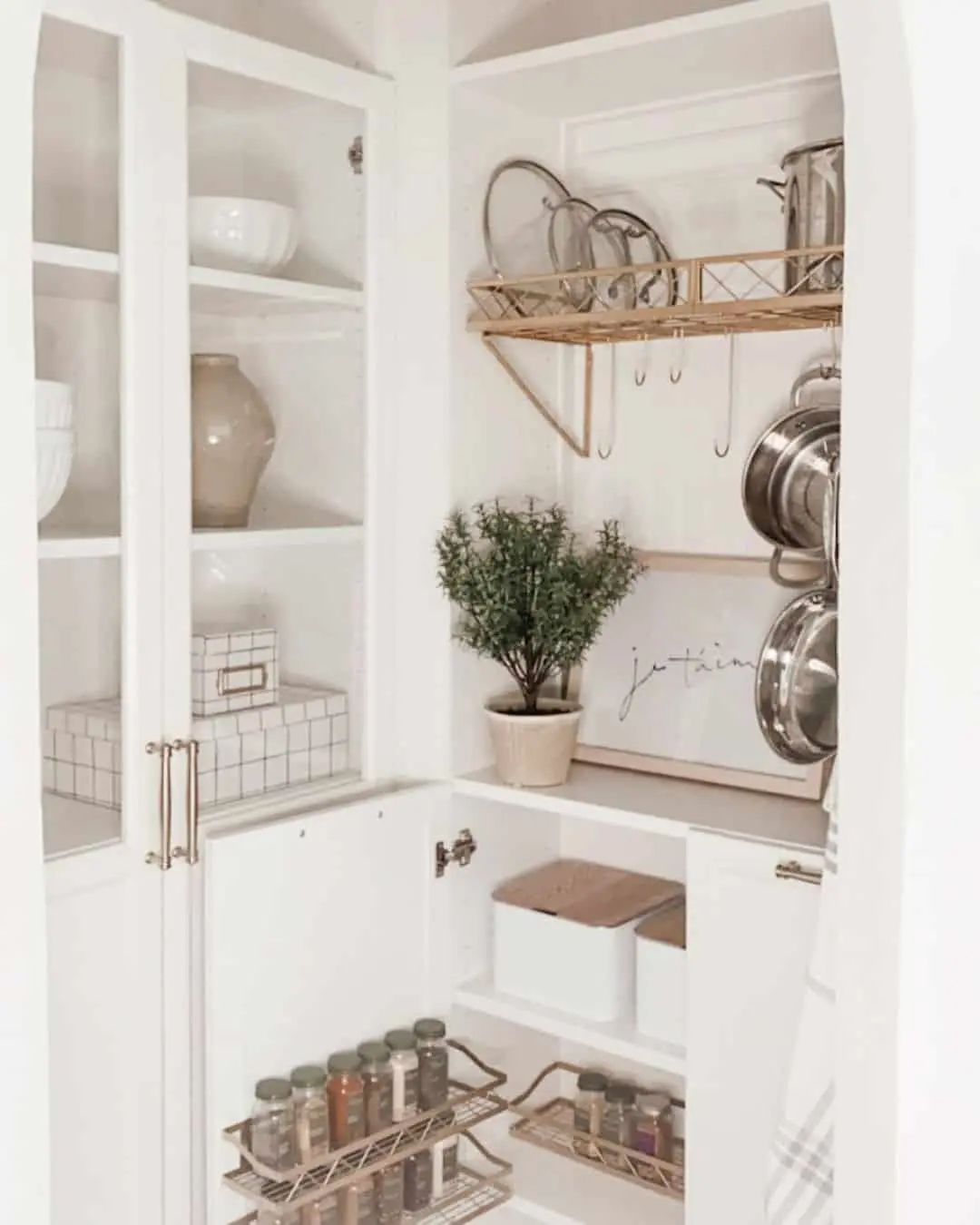 Wall-Mounted Rack Holds Pot Lids Above Hanging Pans