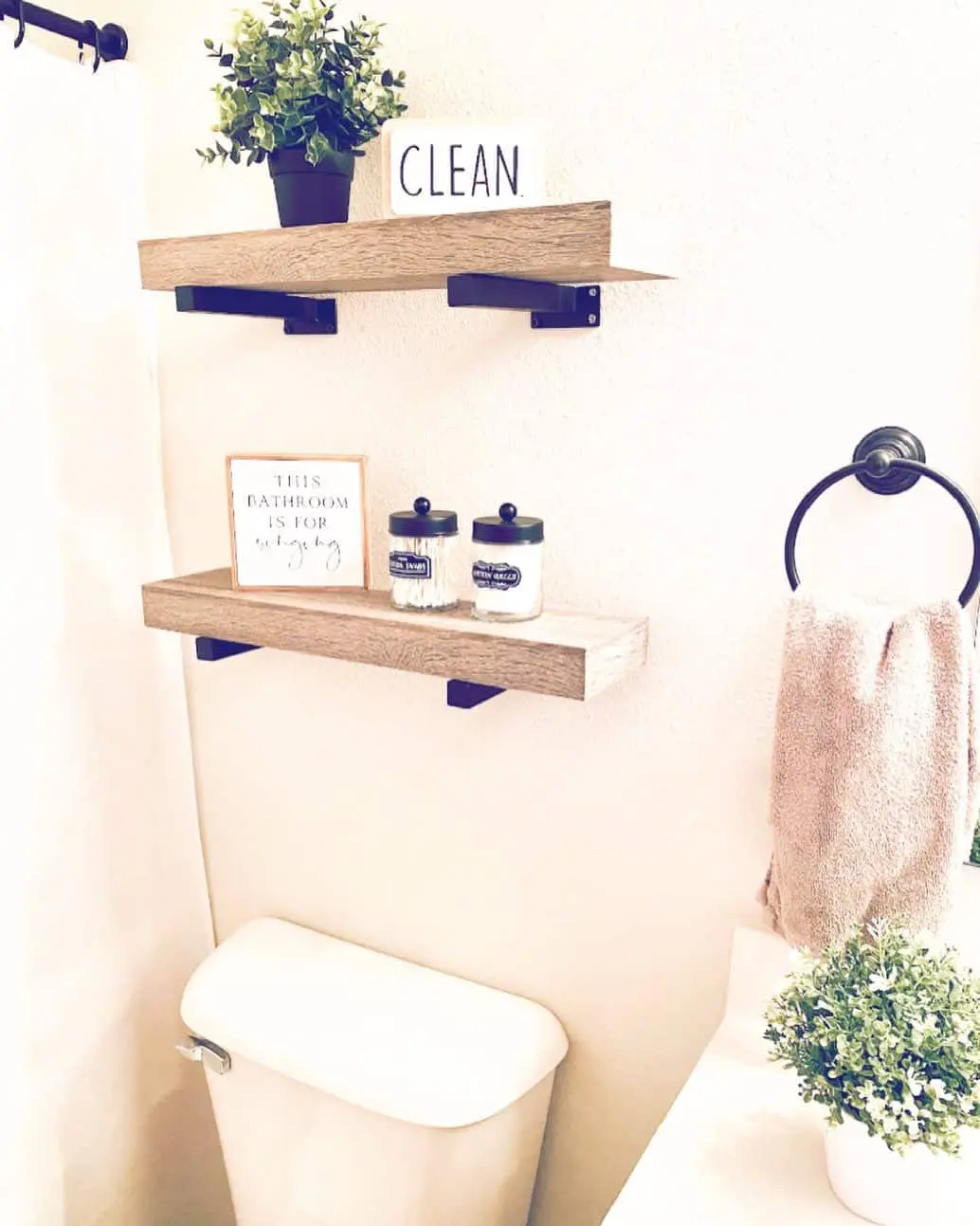 Floating Shelves Displaying Bathroom Essentials and Decor