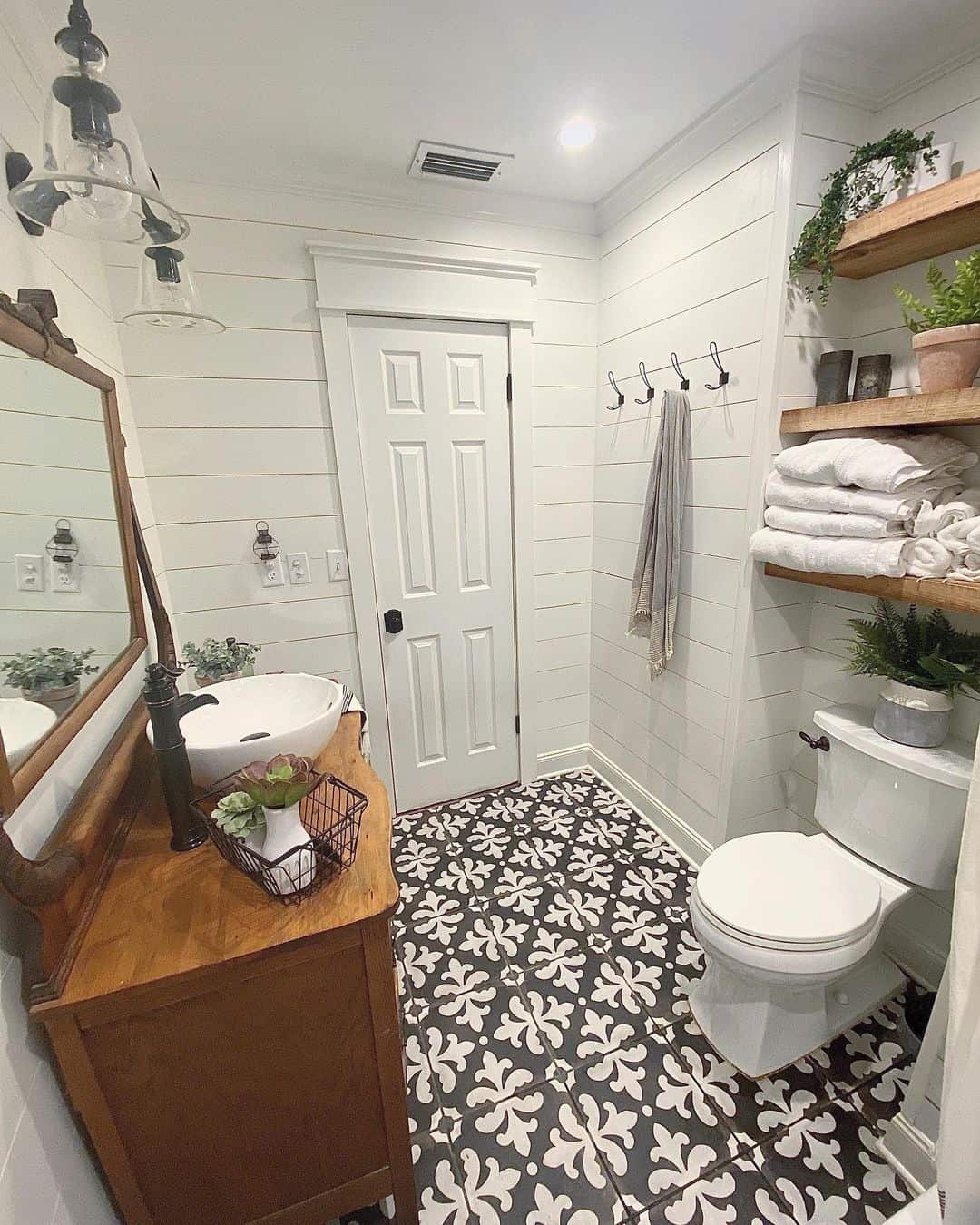 Stack Towels and Greenery on Rustic Wood Shelves