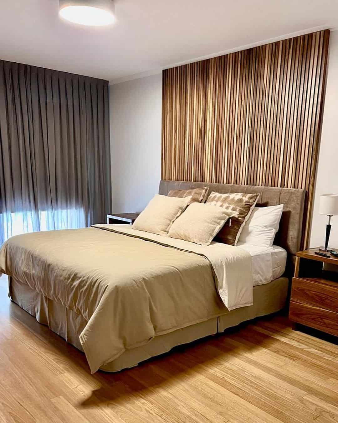 Vertical Wood Slats Create a Warm, Sculptural Headboard Wall