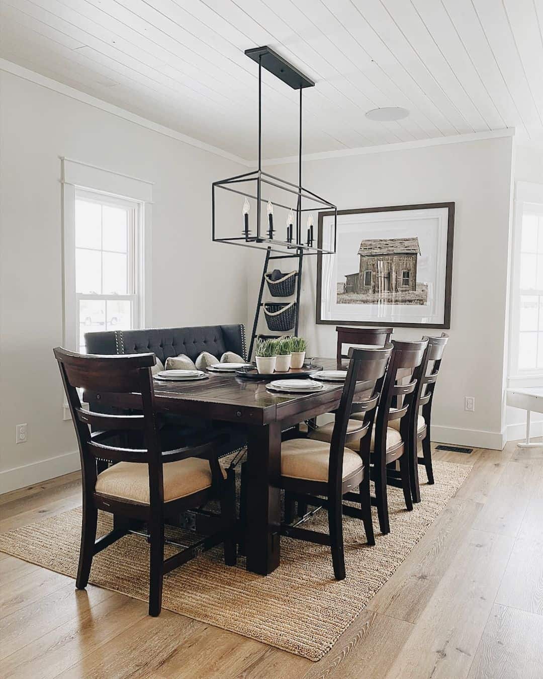 Black Metal Ladder Holds Woven Baskets for Rustic Storage