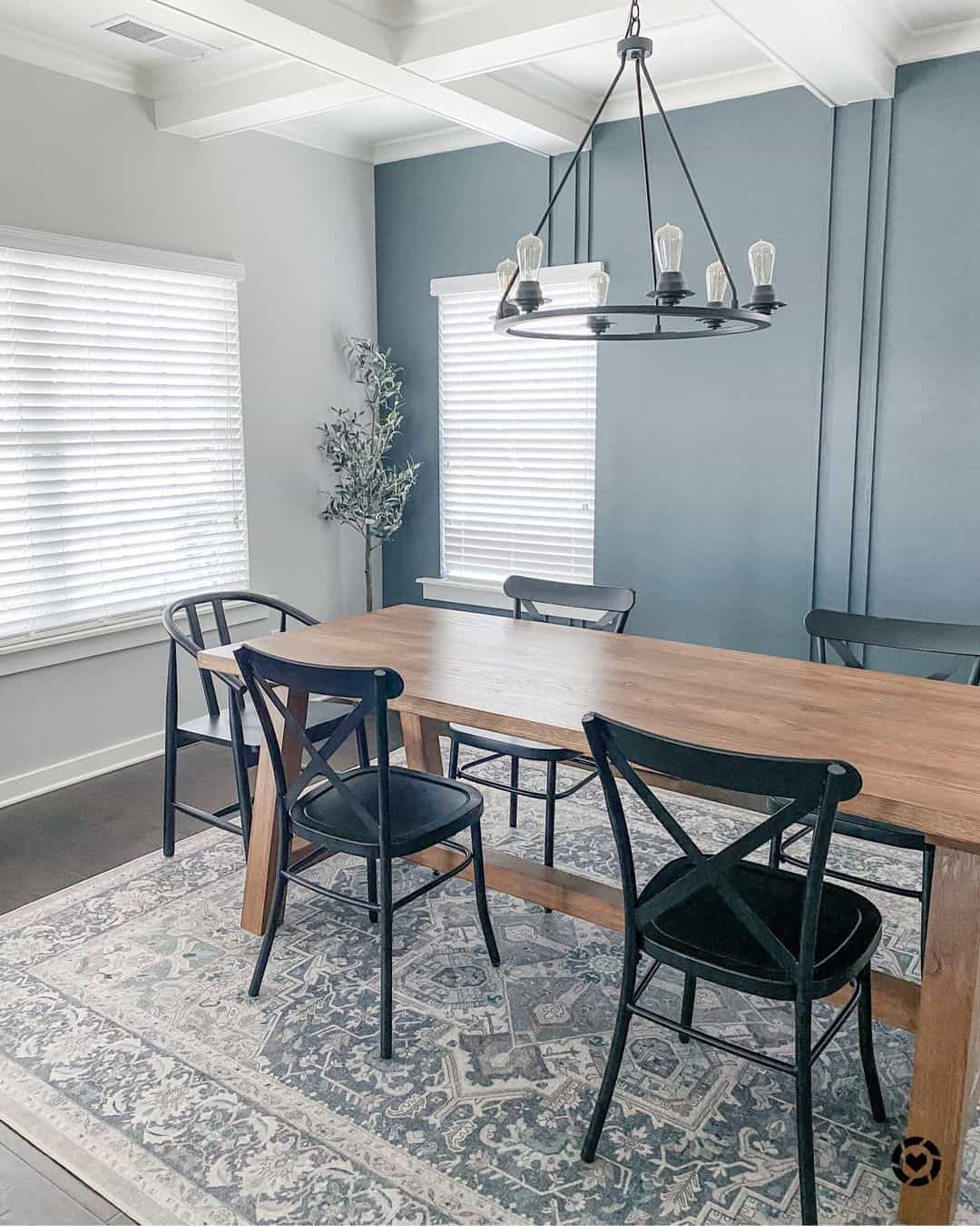Black X-Back Chairs Add Graphic Contrast to Wood Table