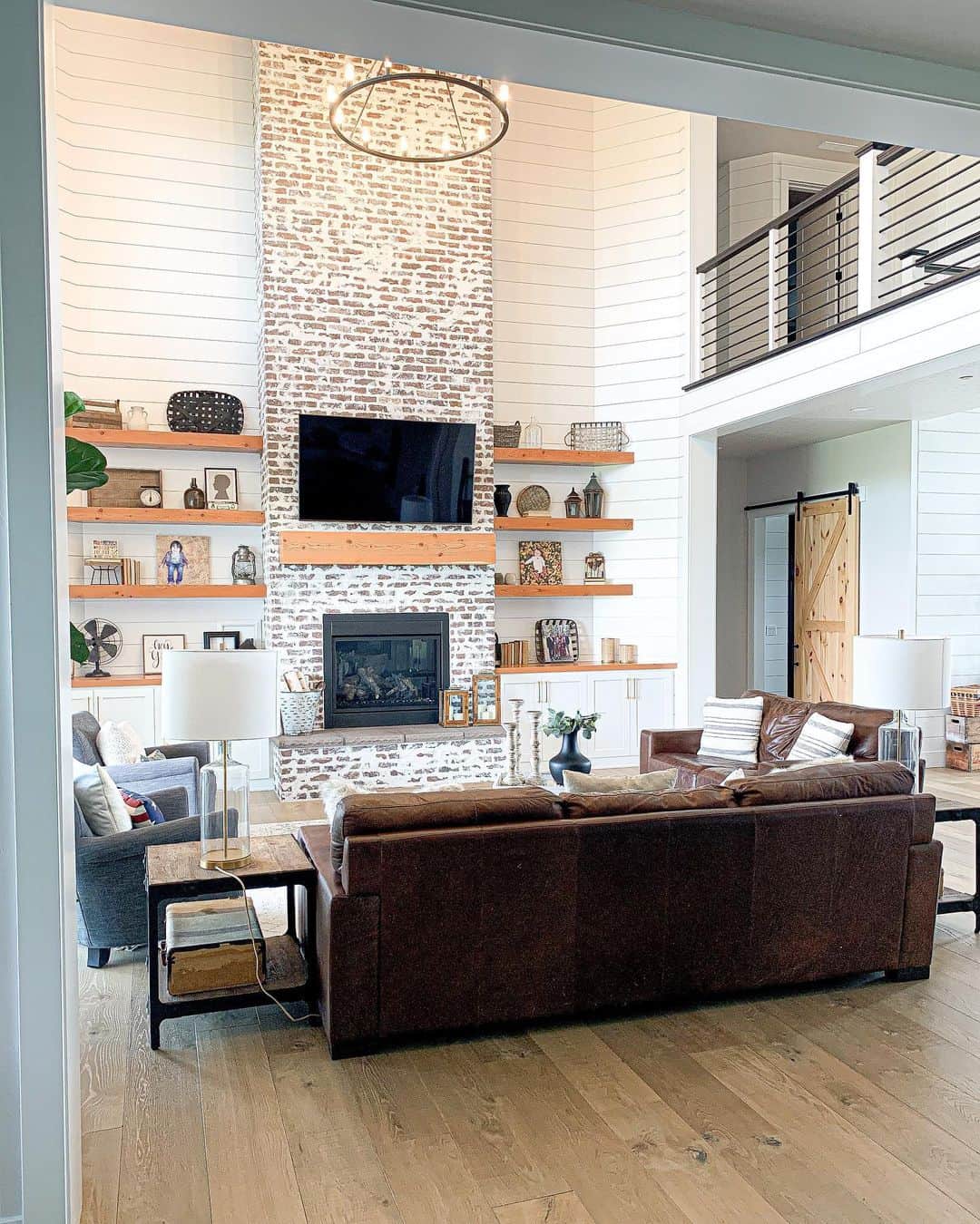 Floating Wood Shelves Accentuate Brick Fireplace