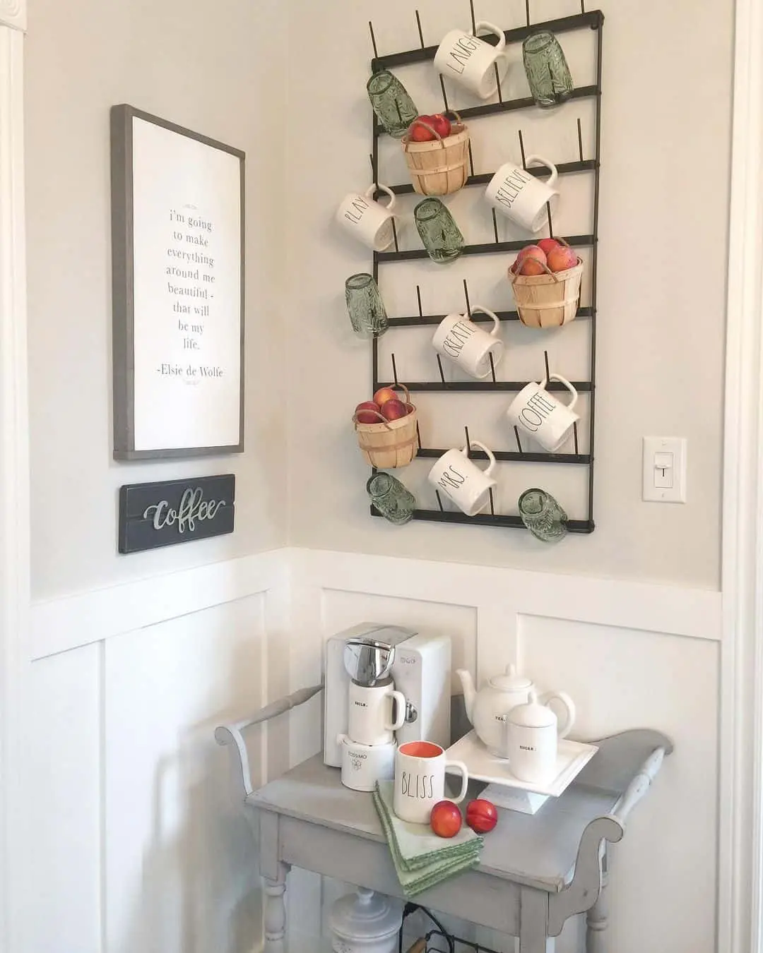 Wall rack displays mugs and small baskets of fruit