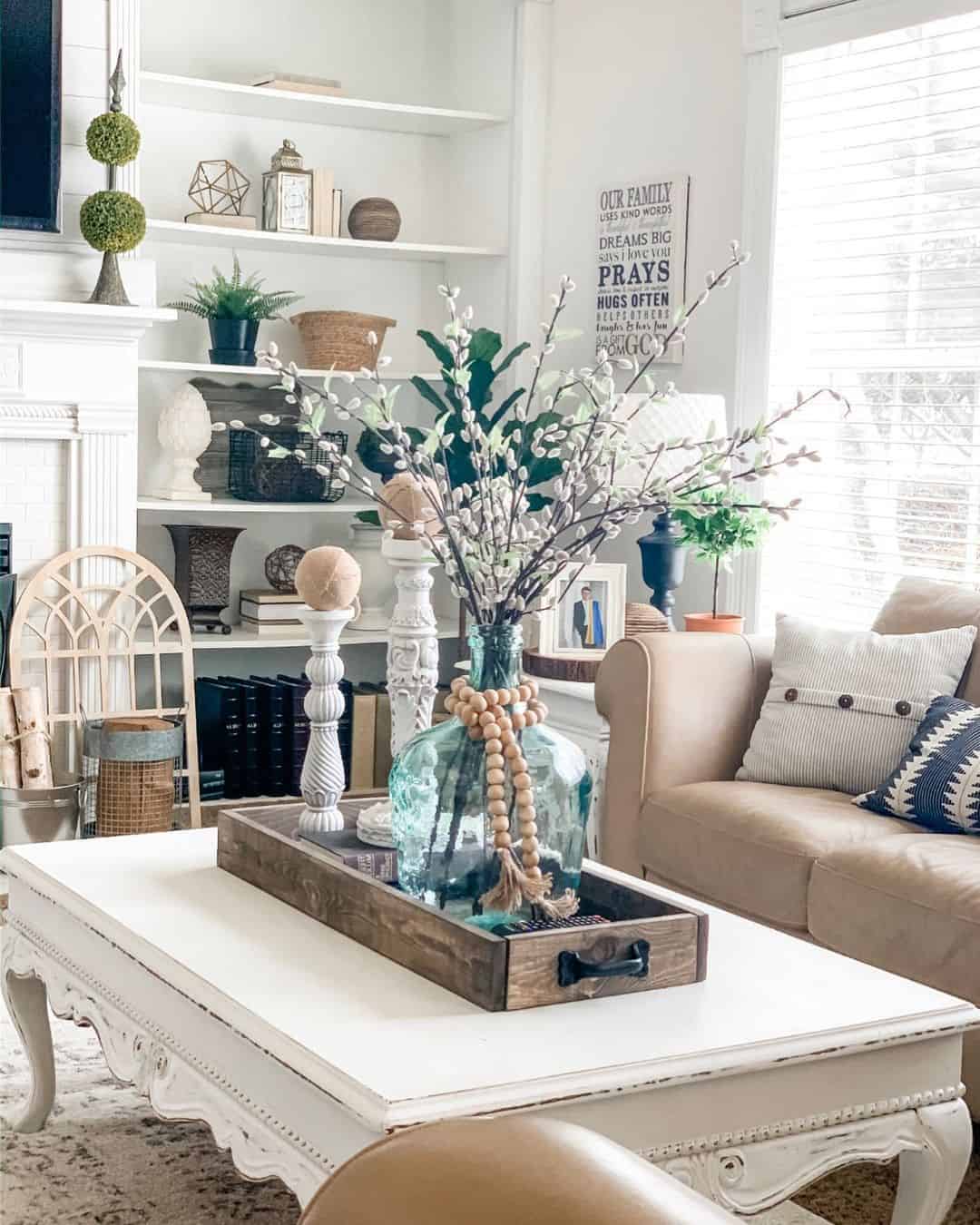 Wooden Tray Holds Large Blue Glass Vase with Branches