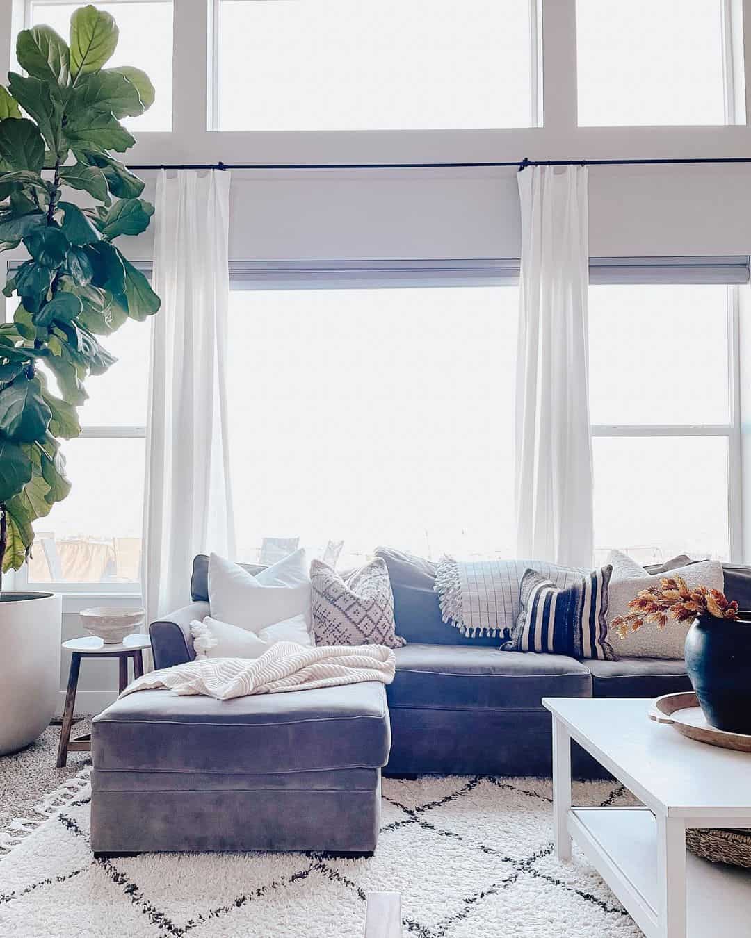Layered White and Black Pillows Add Graphic Contrast to Your Dark Sofa