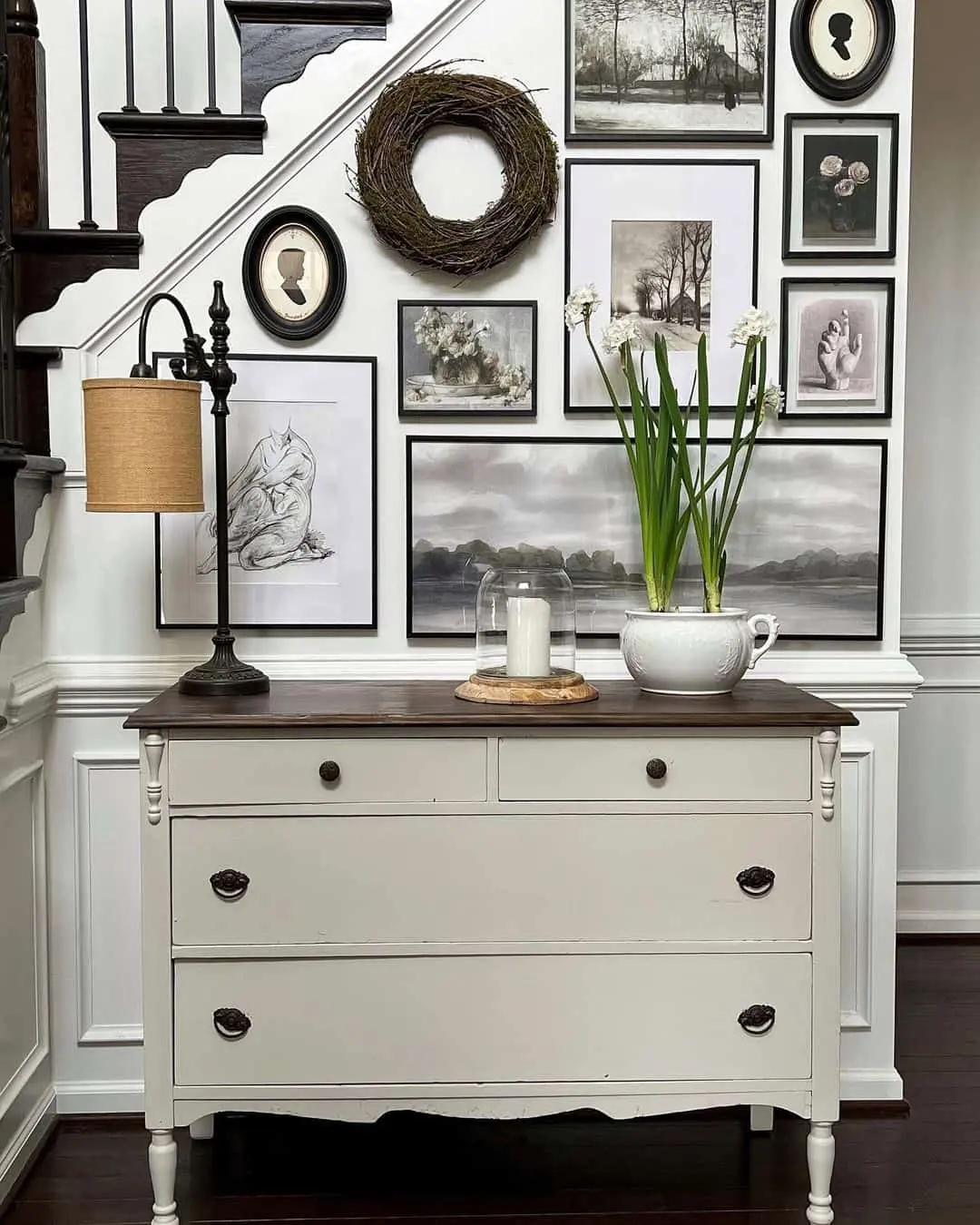 Gallery Wall Above Dresser Anchored by Grapevine Wreath