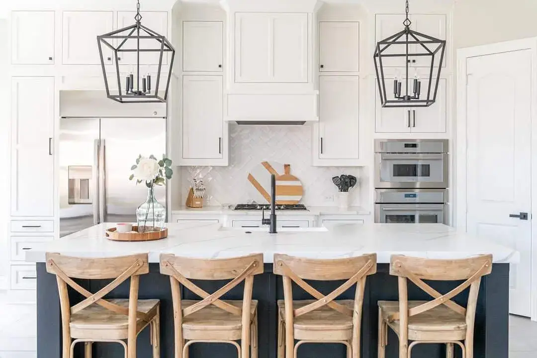 Geometric Lanterns Suspend Over White Kitchen Island