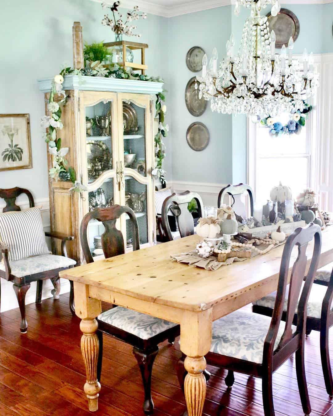 Light Wood Table with Patterned Chairs and Hutch