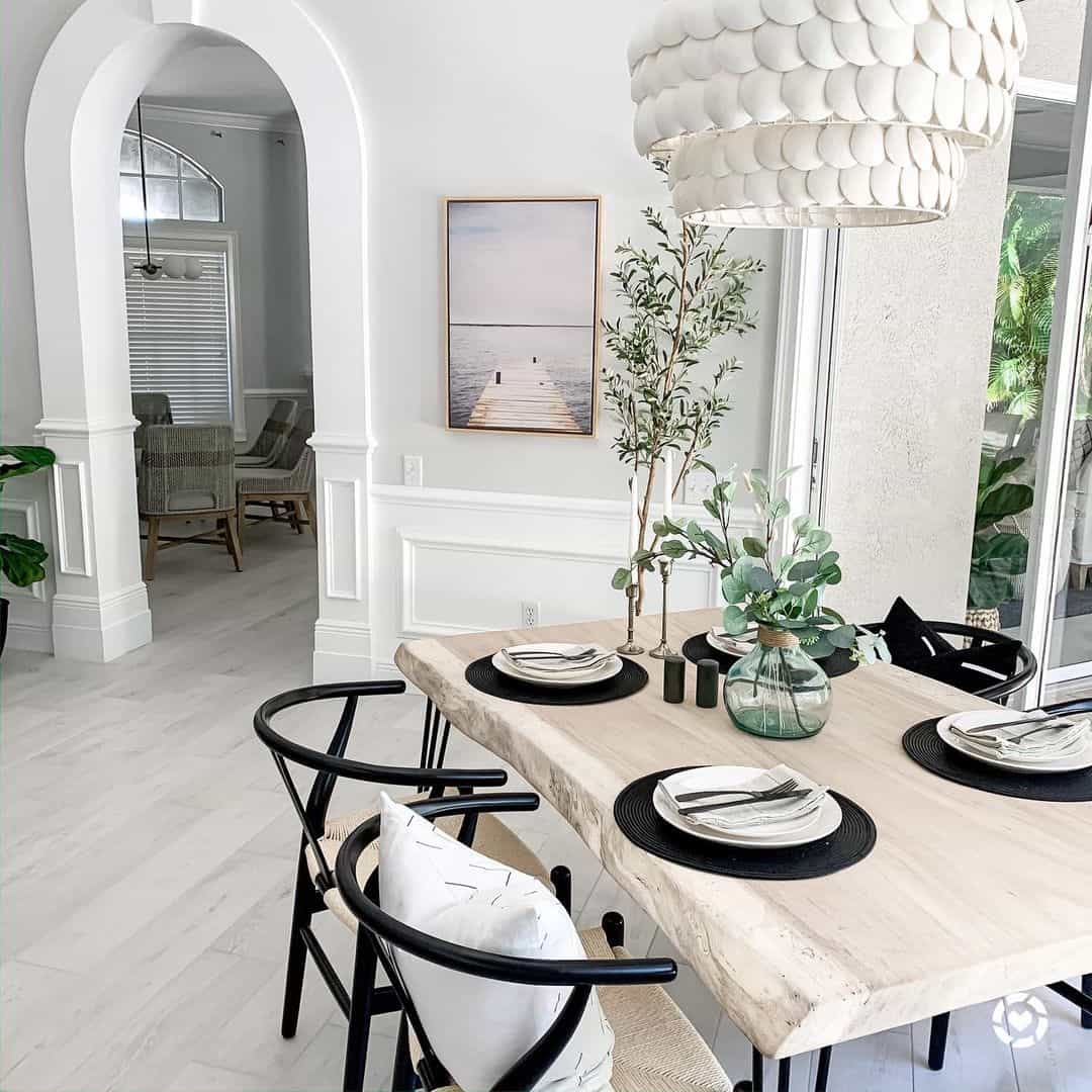 Live-Edge Light Wood Table With Black Wishbone Chairs