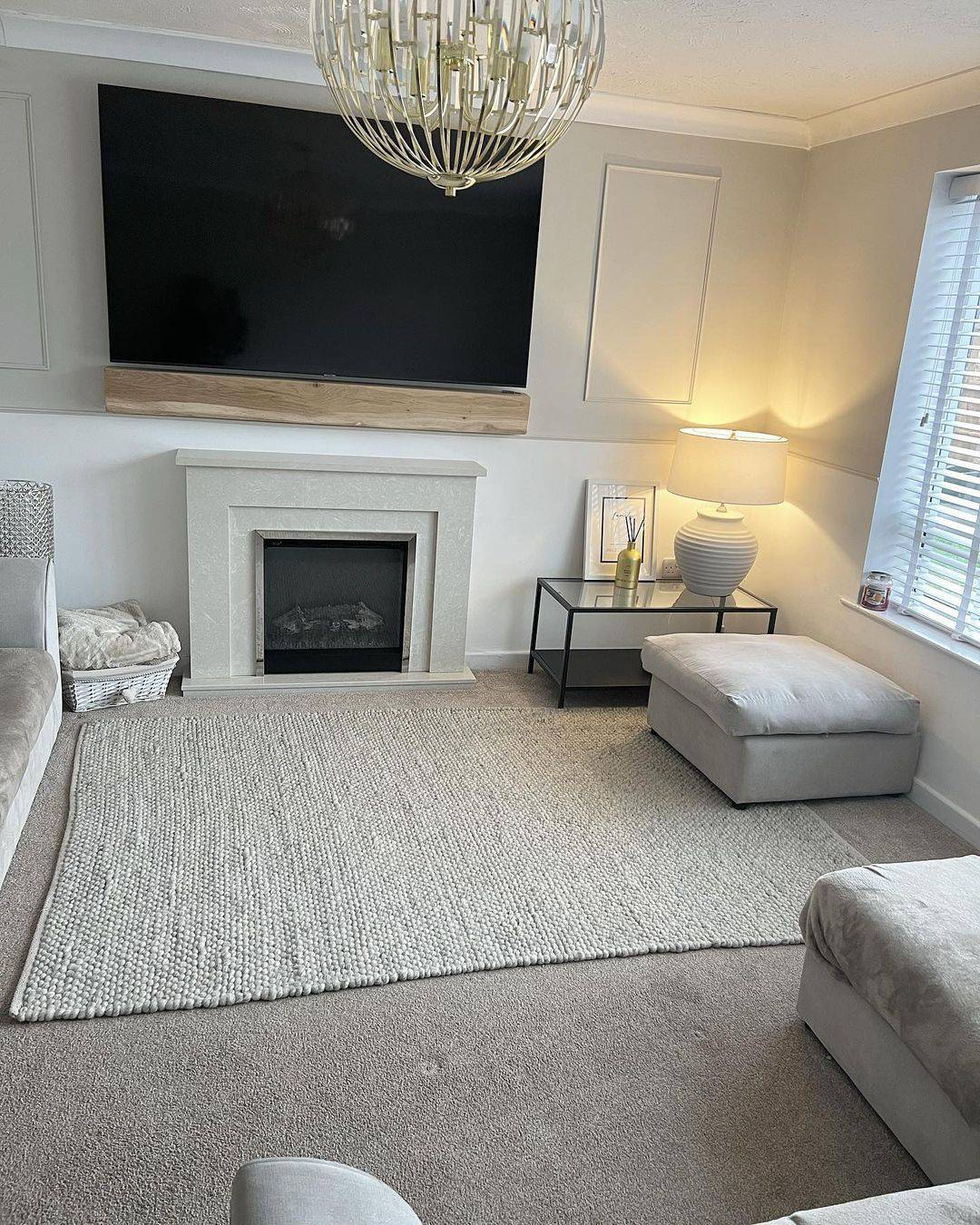 Frame Art Above a Stone Fireplace With a Minimalist Mantel