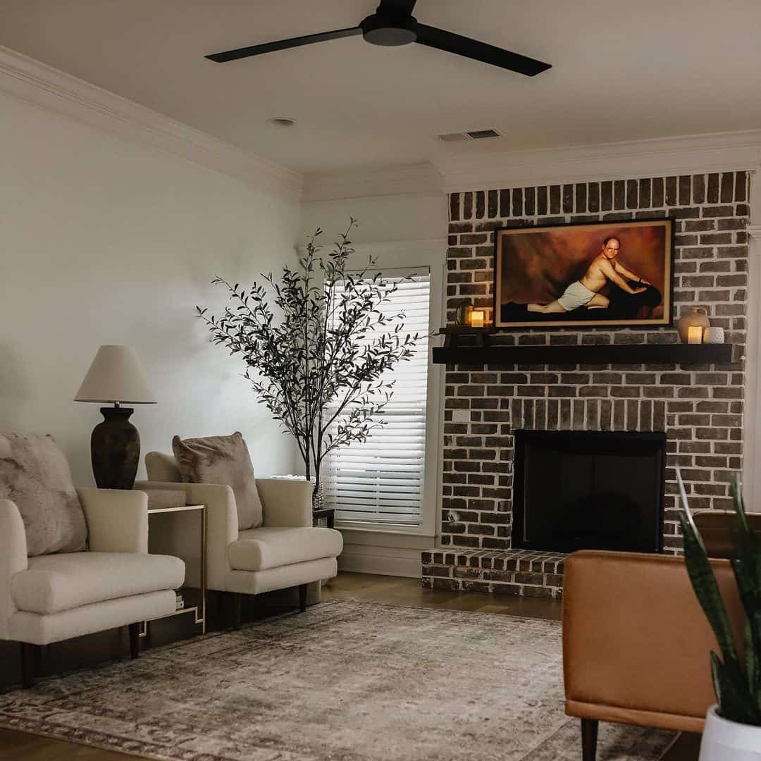 Symmetrically Frame Art With Sconces on a Brick Fireplace