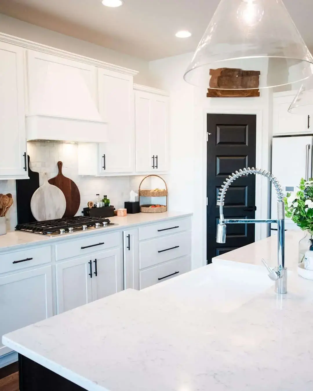 Black Door With Paneled Detail Creates a Dramatic Contrast