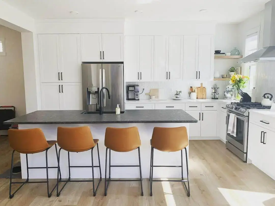 Sleek Black Bar Stools Add Warmth to Island