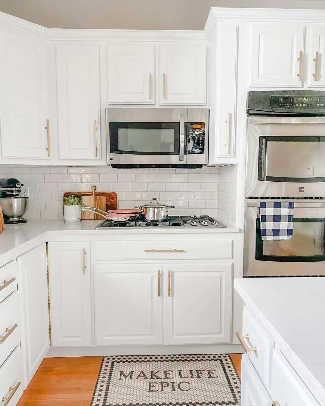 Hexagonal Floor Mat Adds Textural Interest to White Kitchen