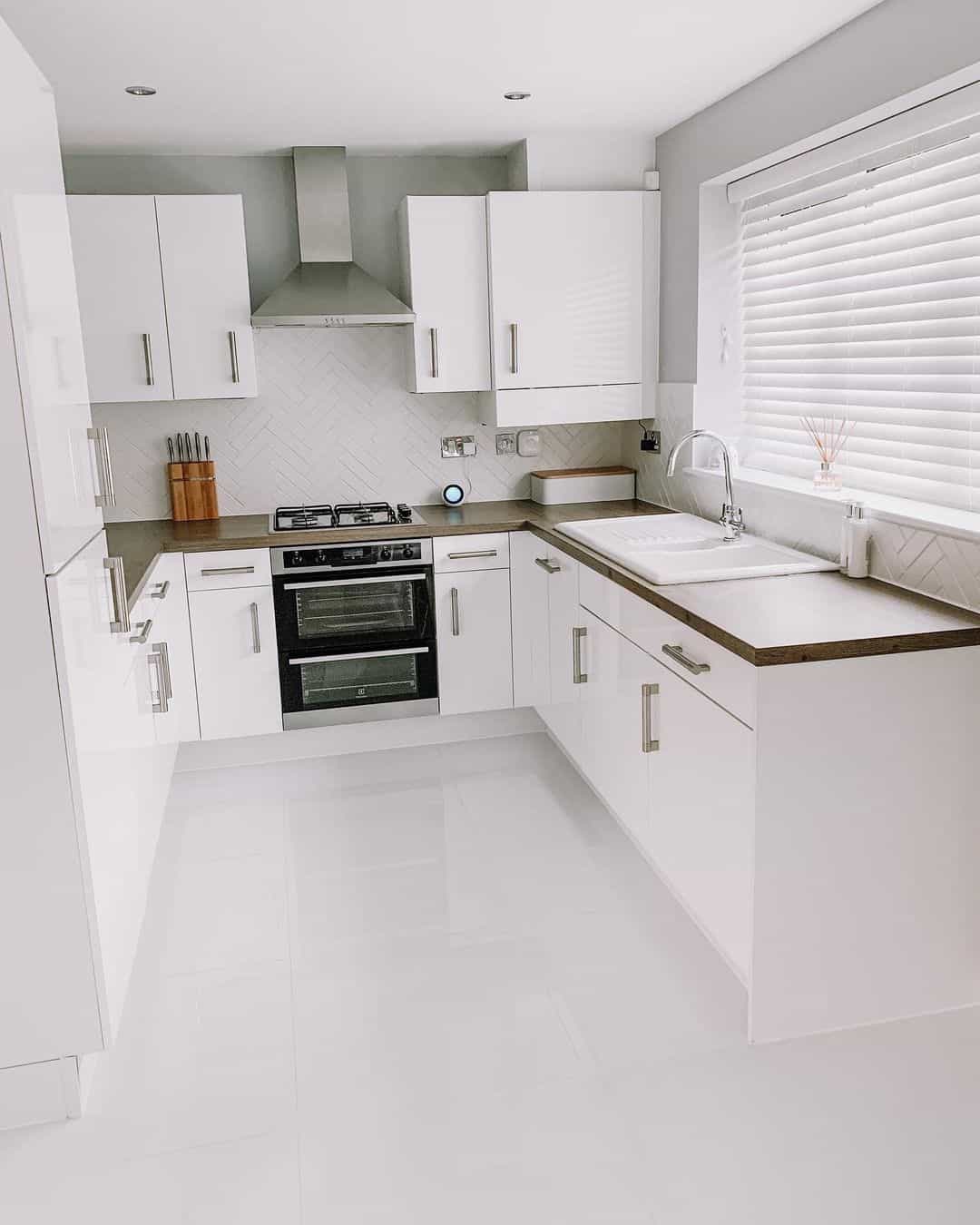 Herringbone Tile Backsplash Adds Subtle Pattern Behind Stove