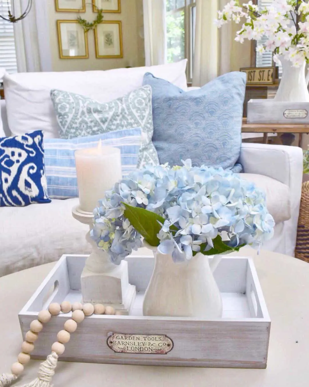 White Tray With Vintage Label Holds Hydrangeas
