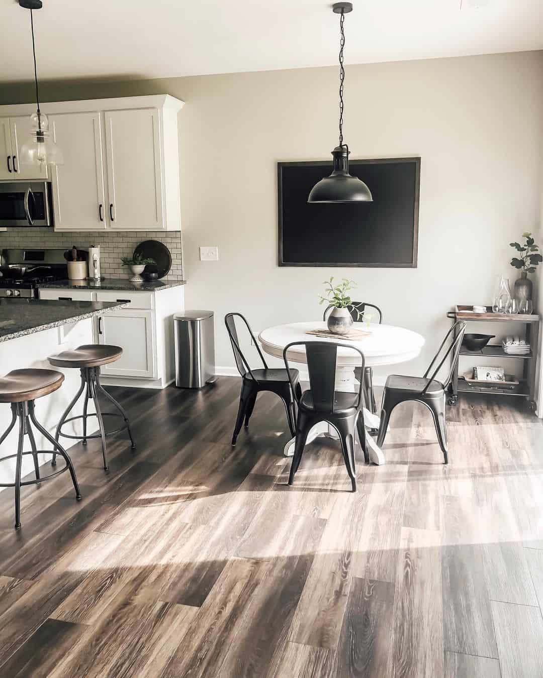 Round White Table With A Farmhouse Pendant Light