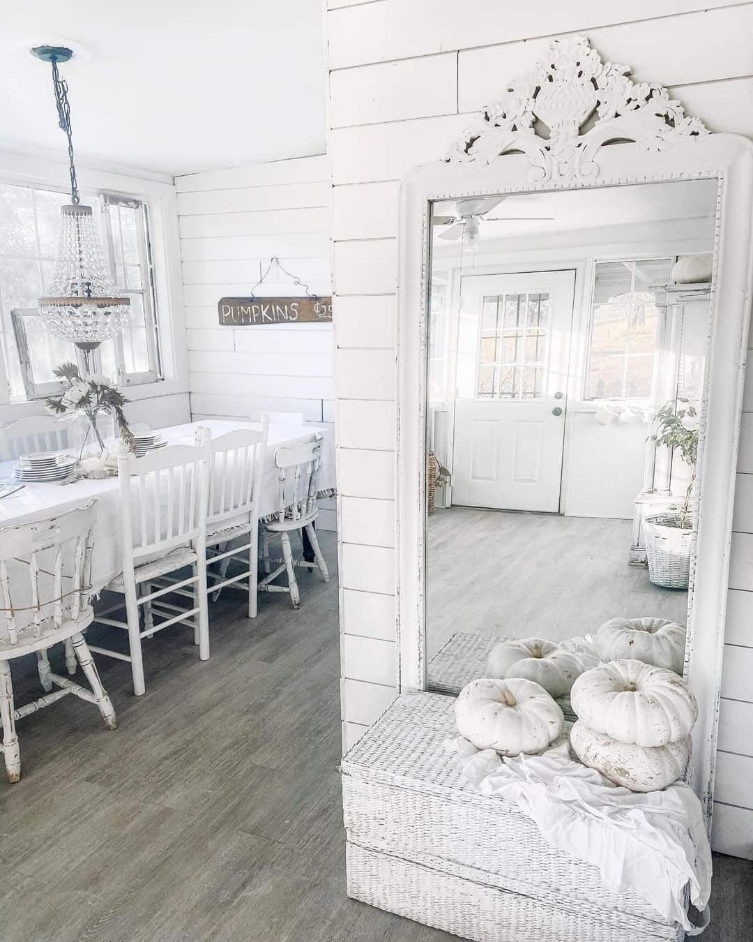 Frame a Stacked Pumpkin Vignette with an Ornate White Mirror