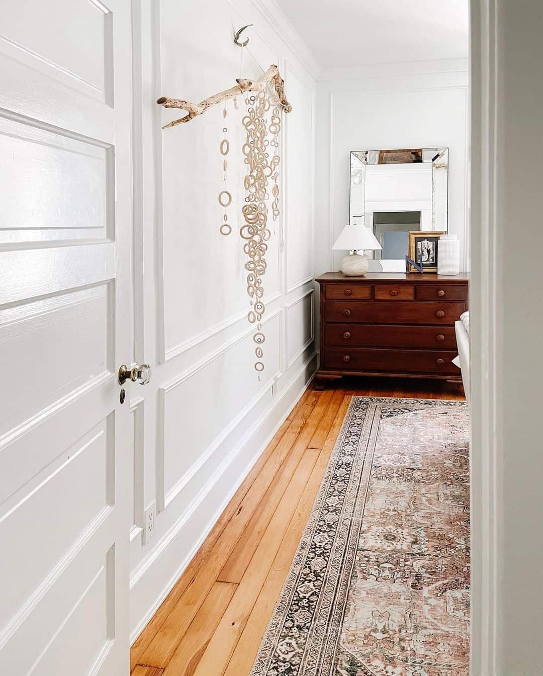 Driftwood Branch Adds Natural Art to White Walls