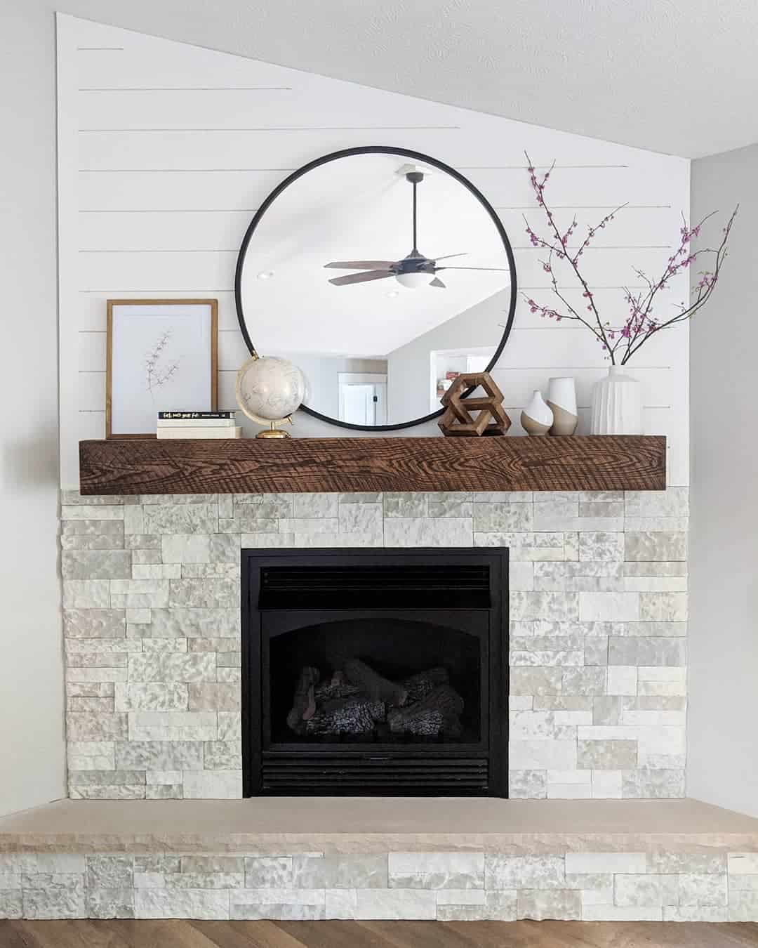 Round Mirror Reflects Light and Adds Depth Above Mantel