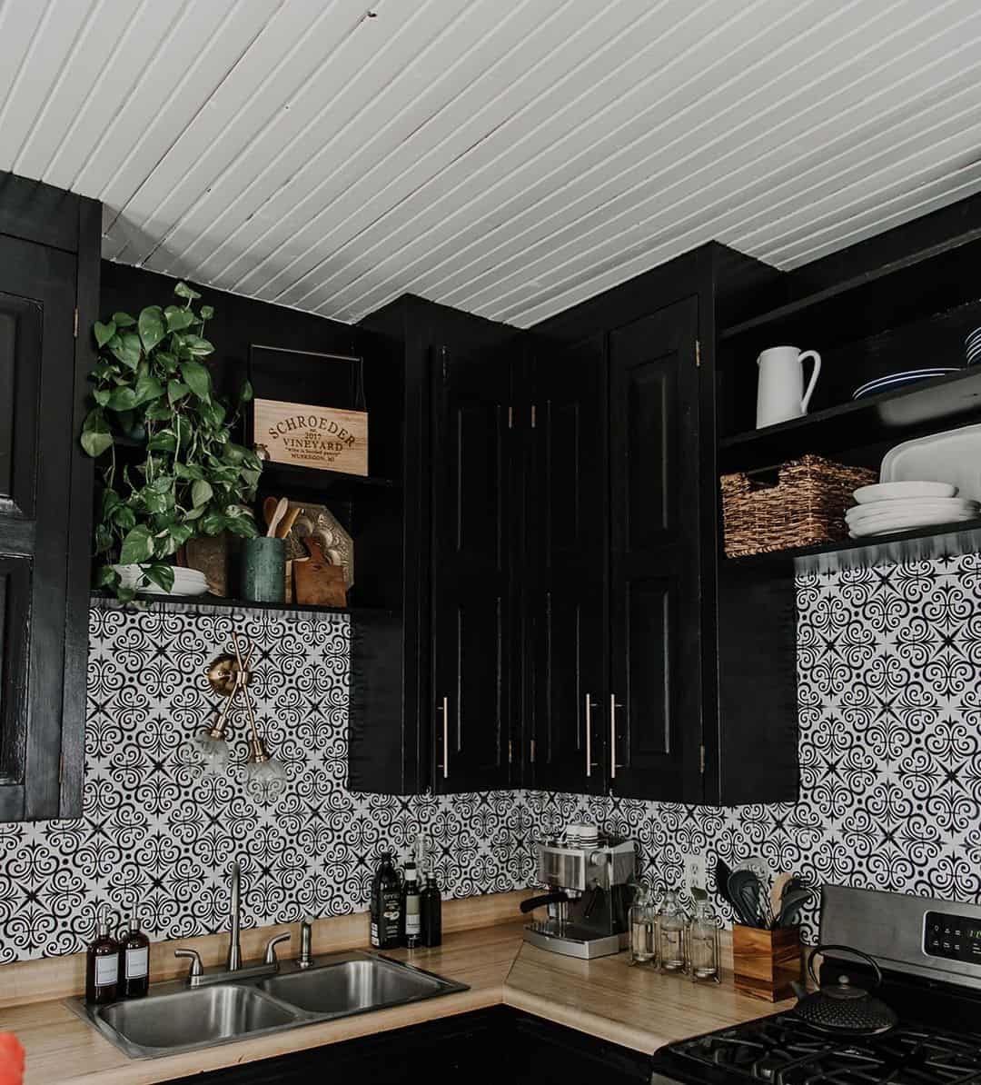 Black and white patterned backsplash adds graphic interest to kitchen