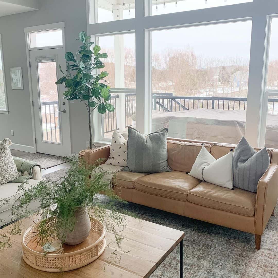 Tan Leather Sofa with Textured Pillows Adds Cozy Layers